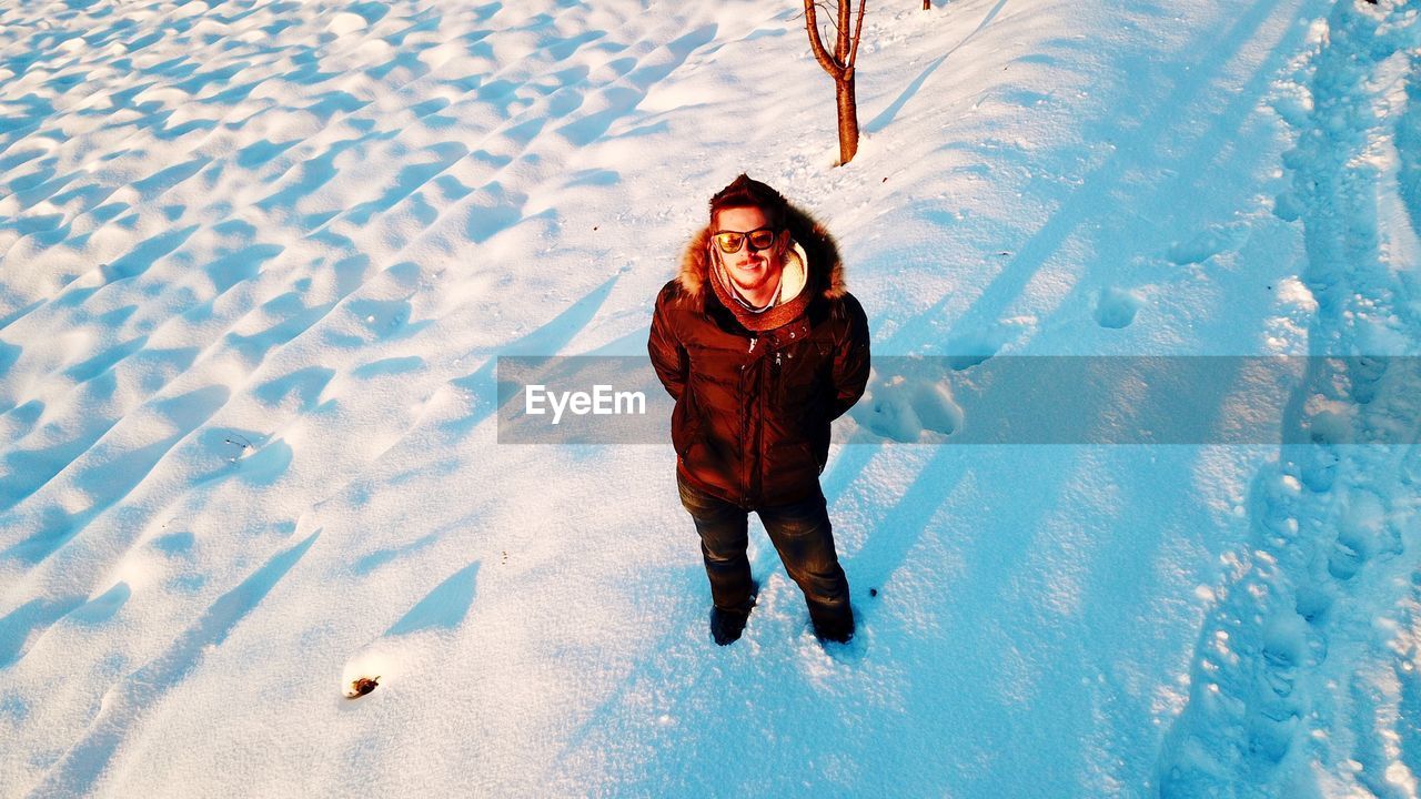 High angle view of man on snow field