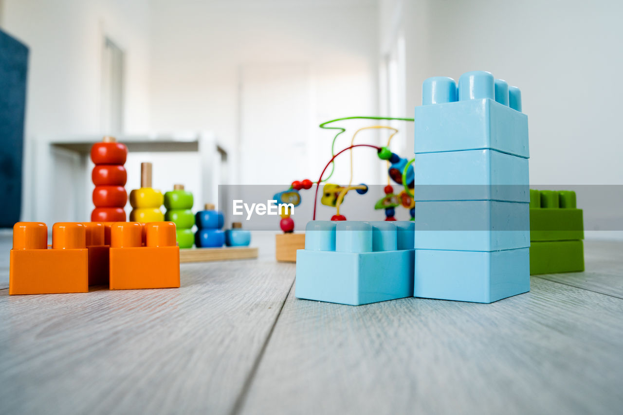 CLOSE-UP OF TOYS ON TABLE