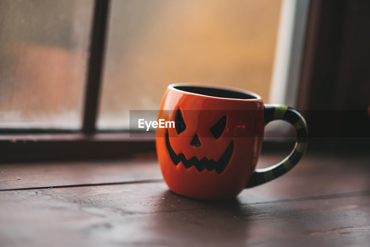 Close-up of coffee cup on table