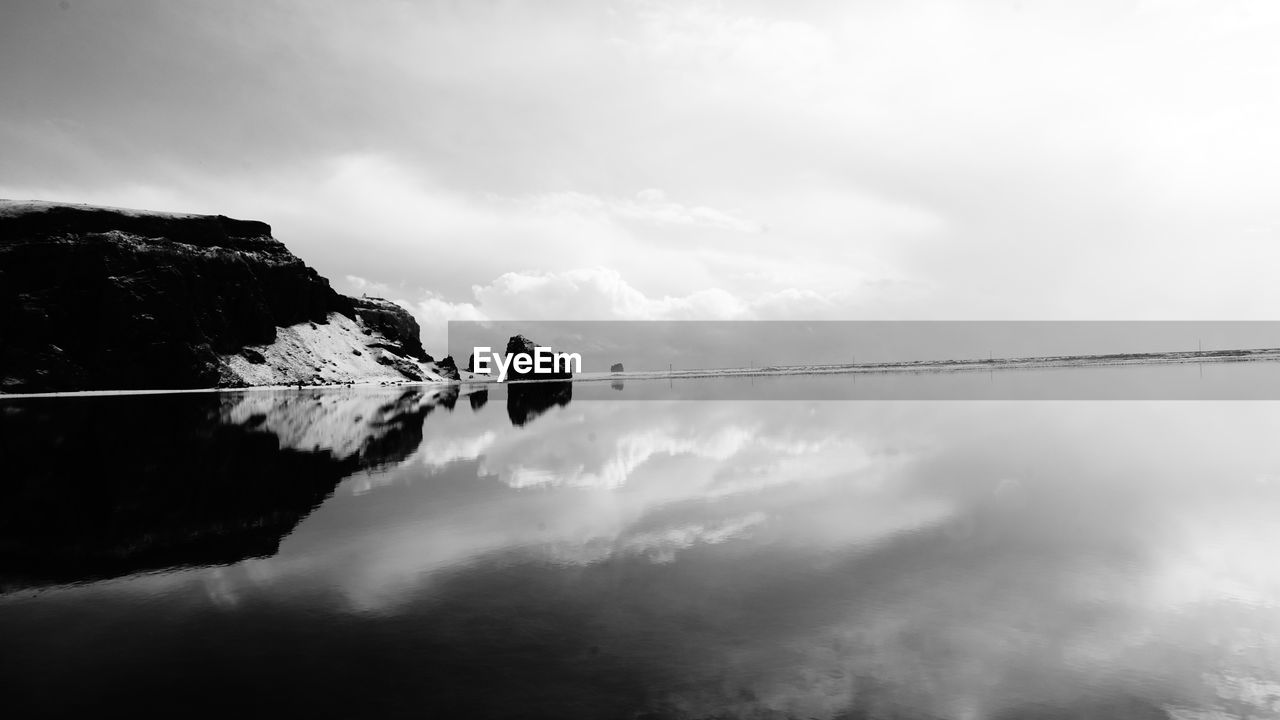 Reflection of clouds in lake against sky