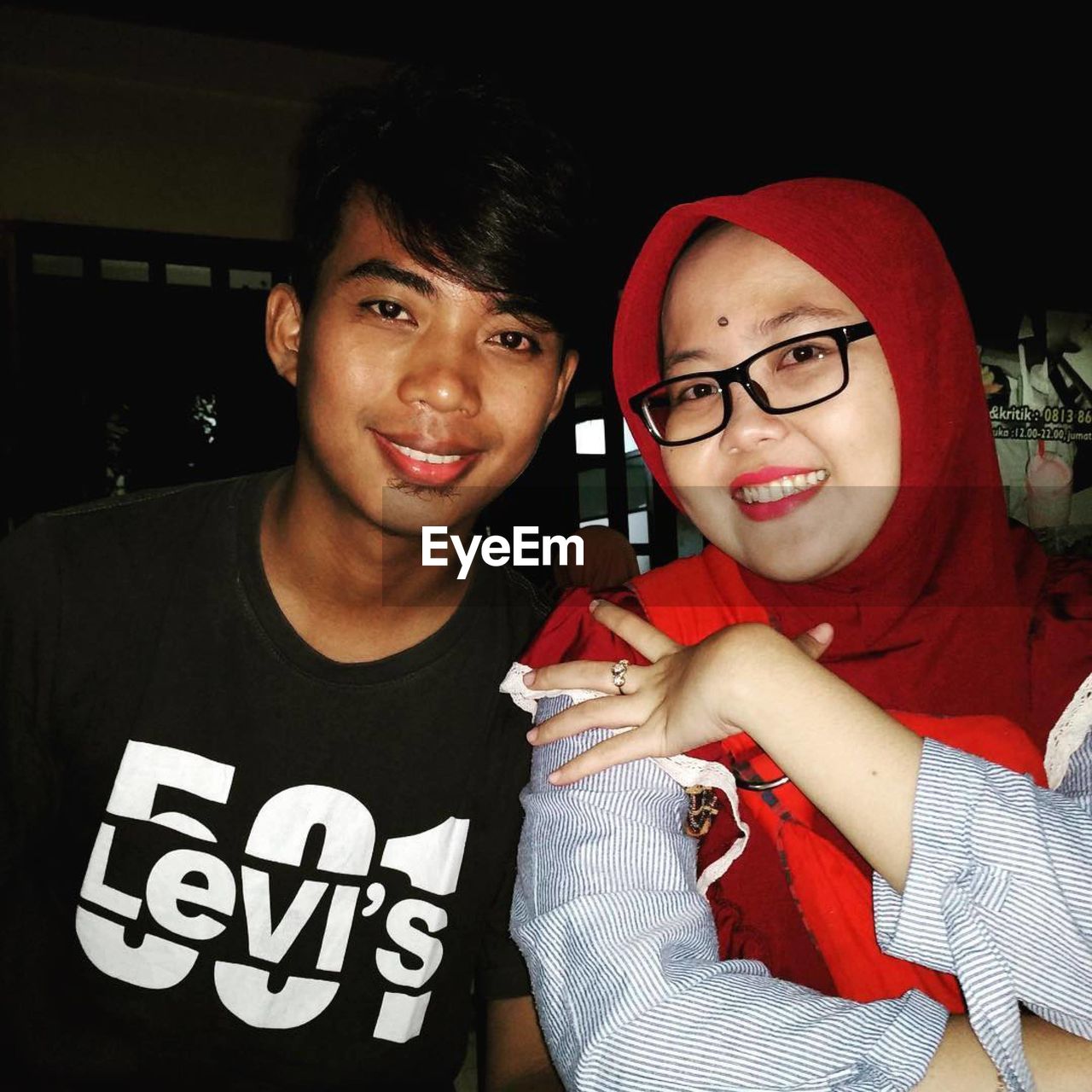 two people, portrait, looking at camera, adult, young adult, men, togetherness, smiling, happiness, emotion, women, eyeglasses, glasses, indoors, casual clothing, lifestyles, positive emotion, waist up, friendship, love, night, clothing, fun, leisure activity, bonding, person, cheerful, arts culture and entertainment, front view, child