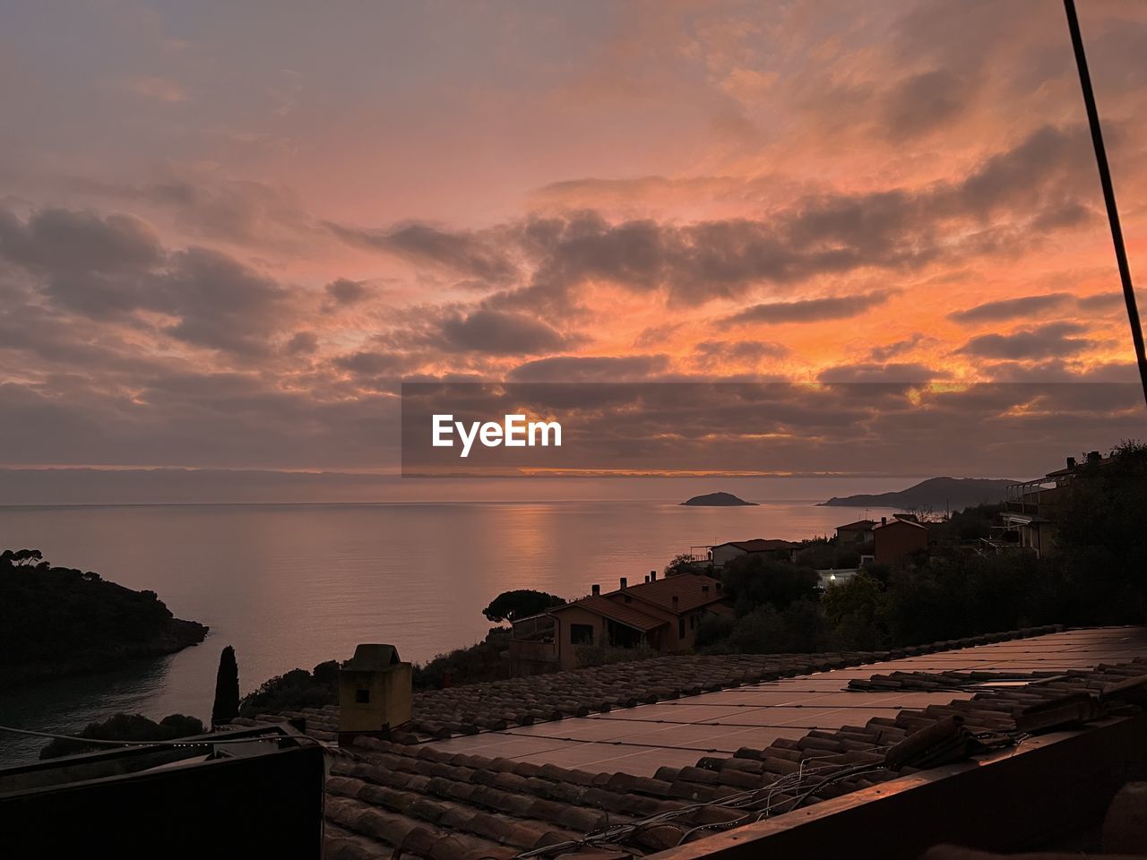 sky, water, sunset, sea, cloud, nature, beauty in nature, architecture, scenics - nature, dusk, horizon, evening, ocean, coast, beach, land, travel destinations, sunlight, environment, tranquility, travel, no people, afterglow, built structure, outdoors, seascape, reflection, landscape, sun, tranquil scene, vacation, horizon over water, trip, holiday, dramatic sky, tourism, building exterior, nautical vessel
