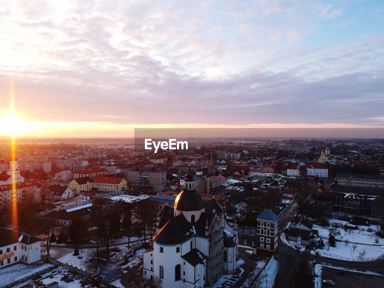 High angle view of townscape against sky during sunset