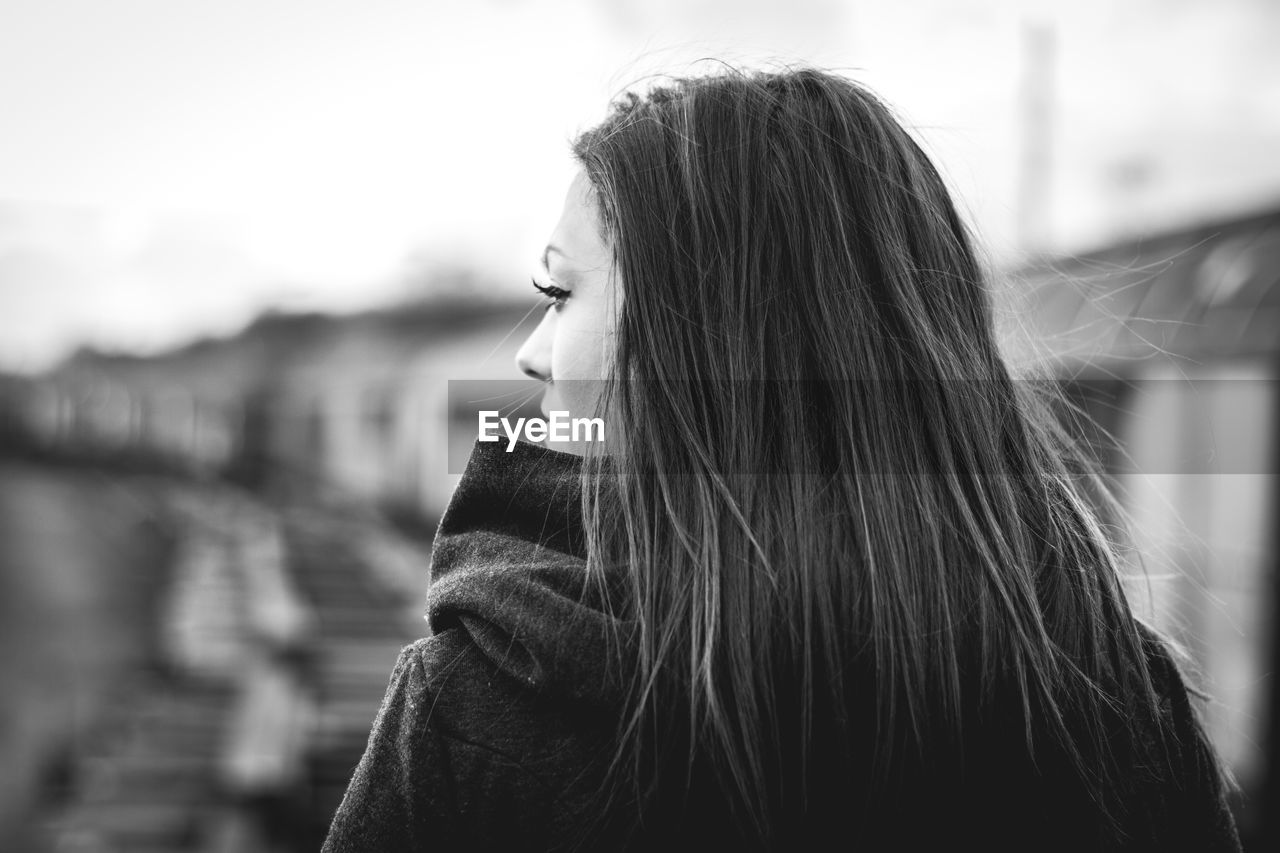 Woman looking away outdoors