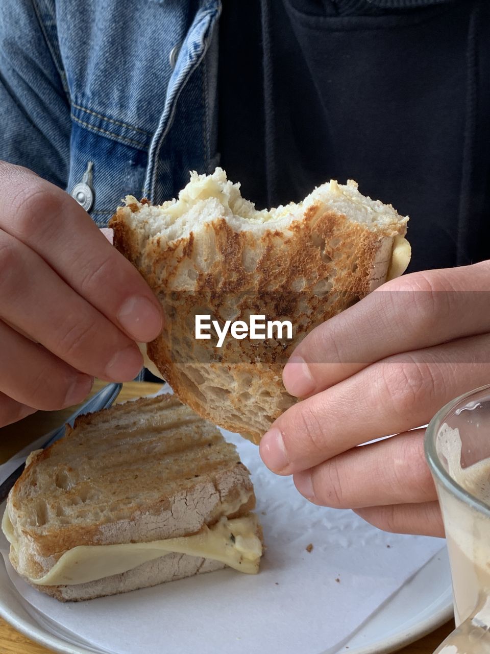 food, food and drink, hand, bread, one person, holding, freshness, adult, fast food, lifestyles, dish, women, indoors, close-up, baked, healthy eating, high angle view, wellbeing, meal, breakfast