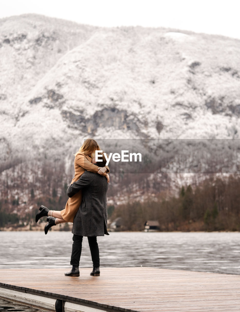 FULL LENGTH OF WOMAN STANDING IN LAKE