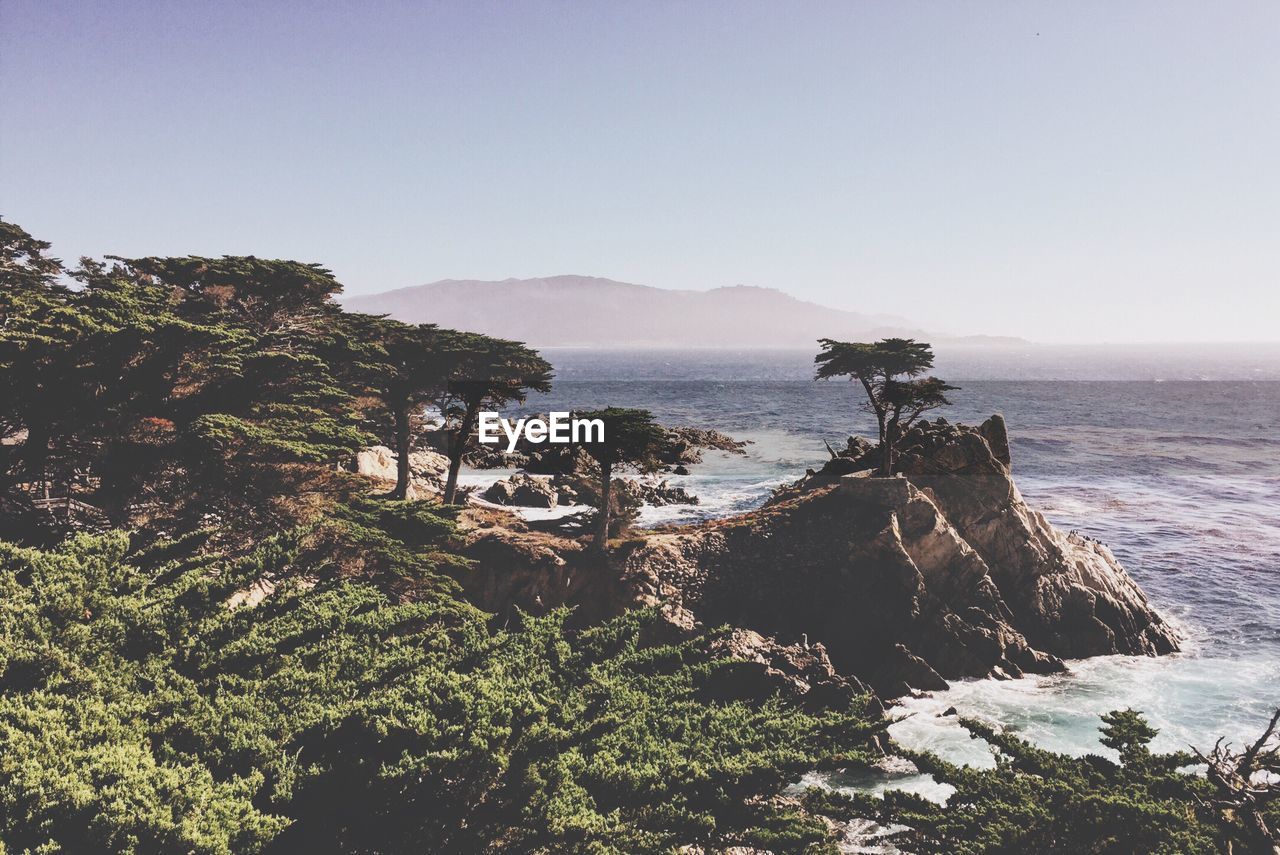 Scenic view of sea with mountains in background