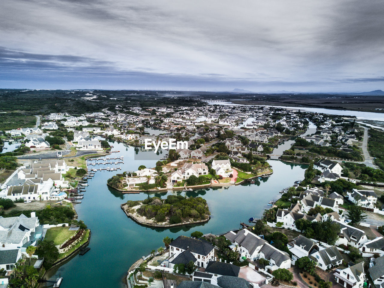 Aerial view of residential district against sky