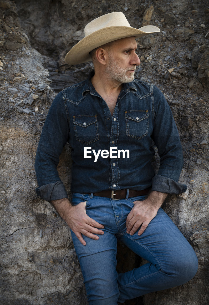 Portrait of man in cowboy hat and jeans