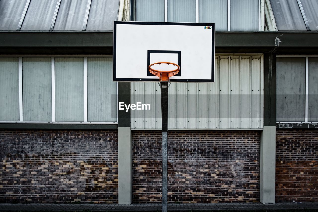 Basketball hoop against building