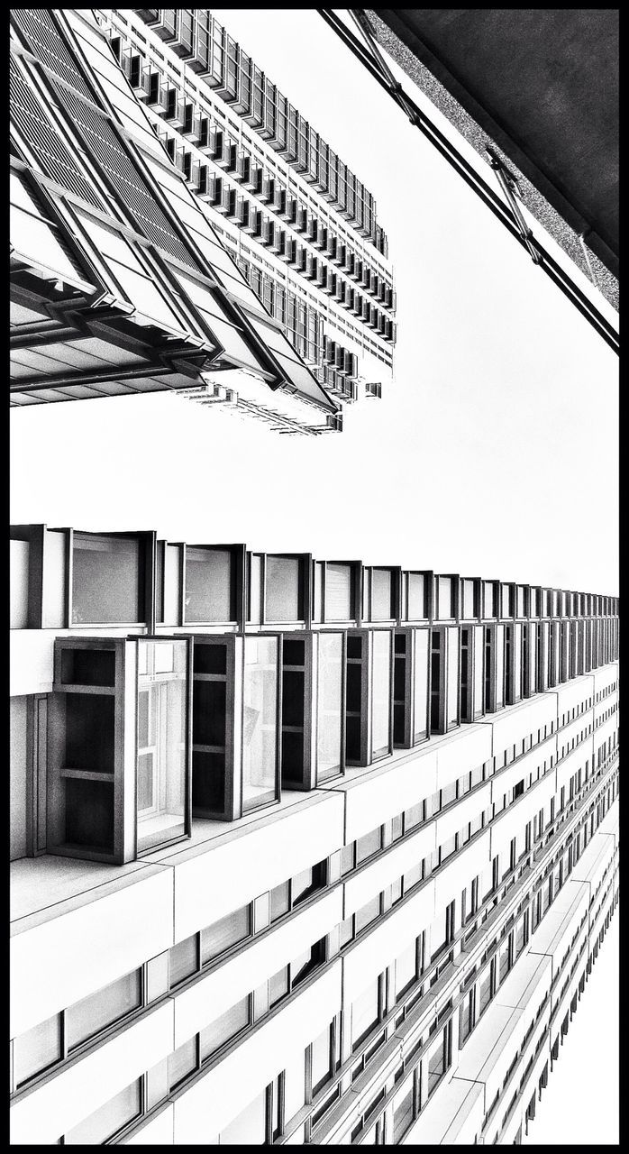 Low angle view of built structures against clear sky