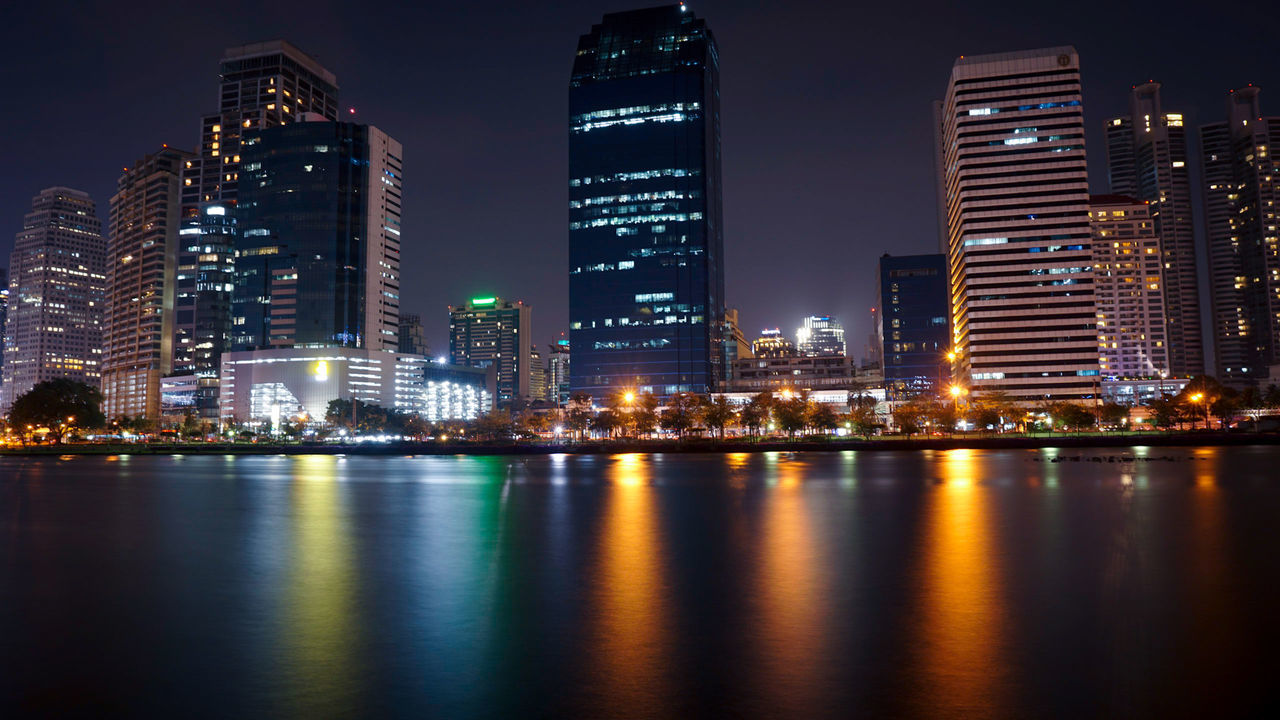 VIEW OF ILLUMINATED CITY AT NIGHT