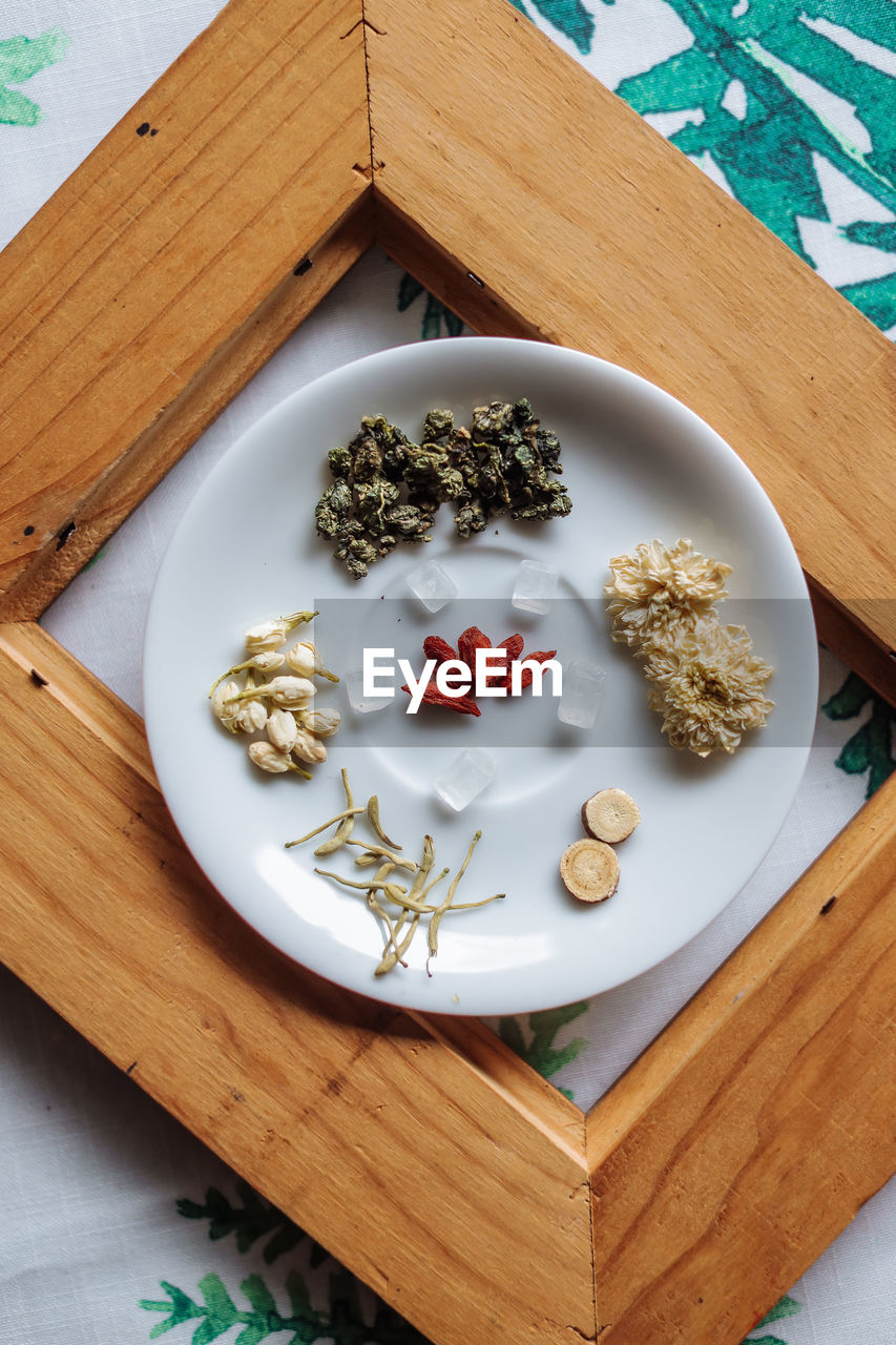 High angle view of tea ingredients on table