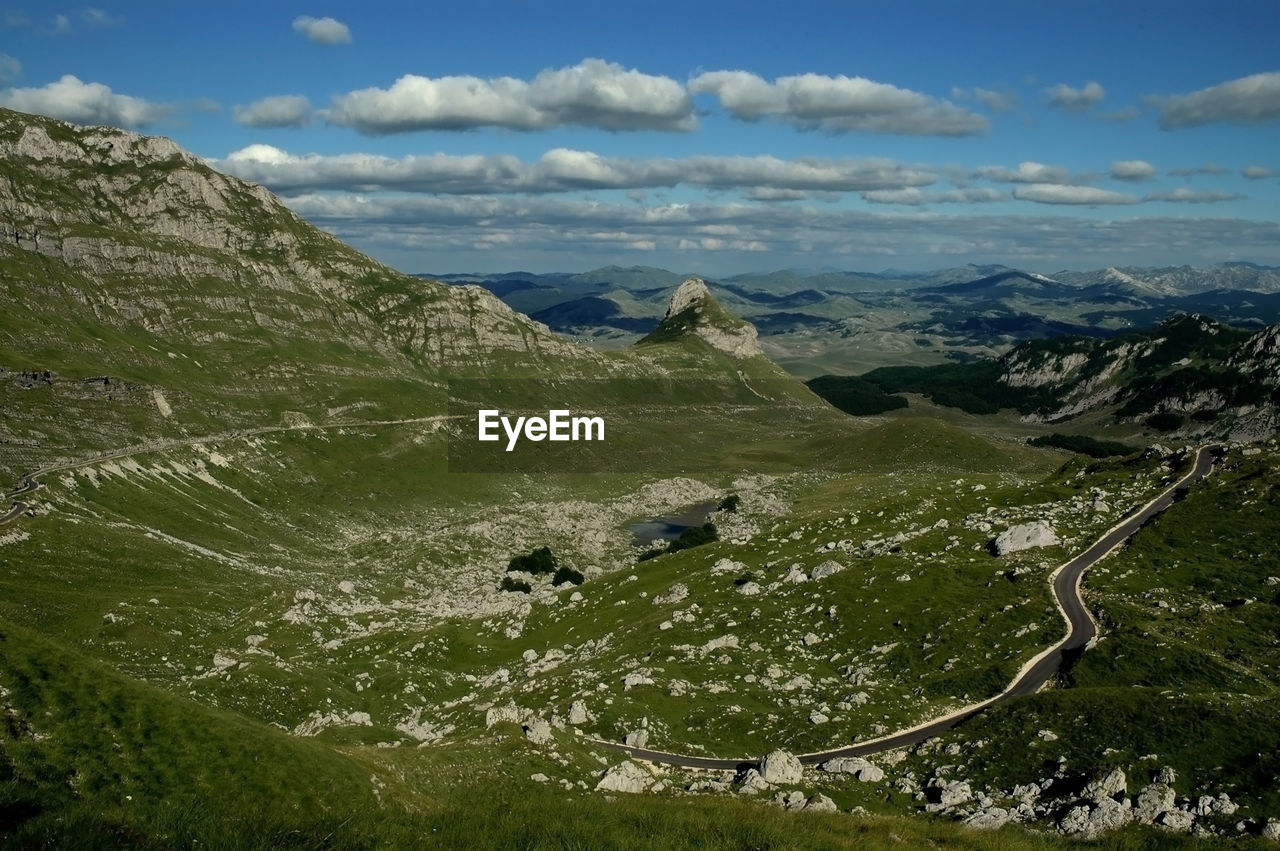 Scenic view of landscape and mountains against sky