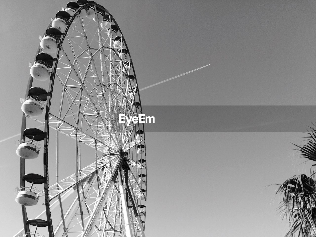 Low angle view of ferris wheel against sky