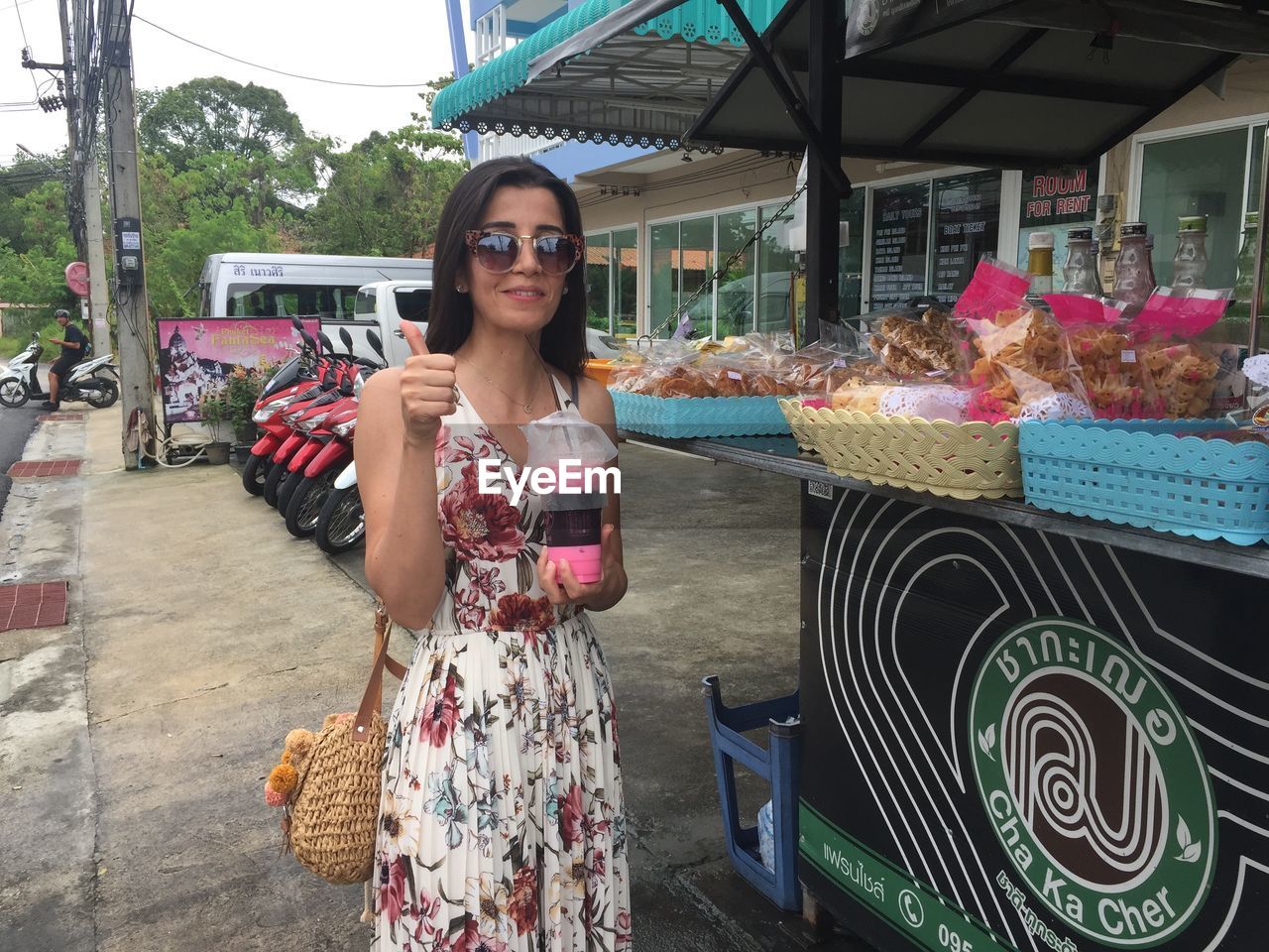 Portrait of woman standing by concession stand