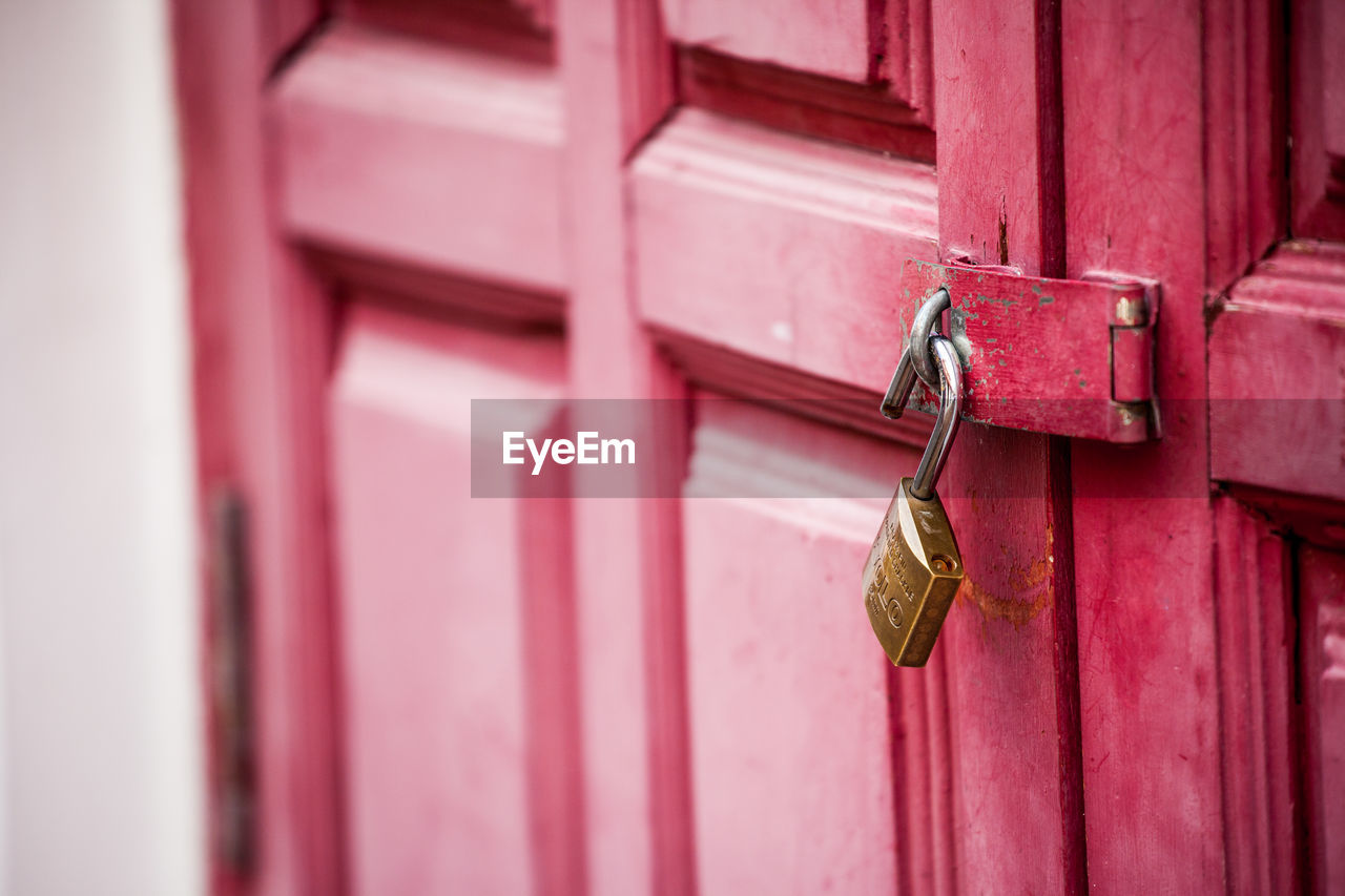 Close-up of padlocks on door