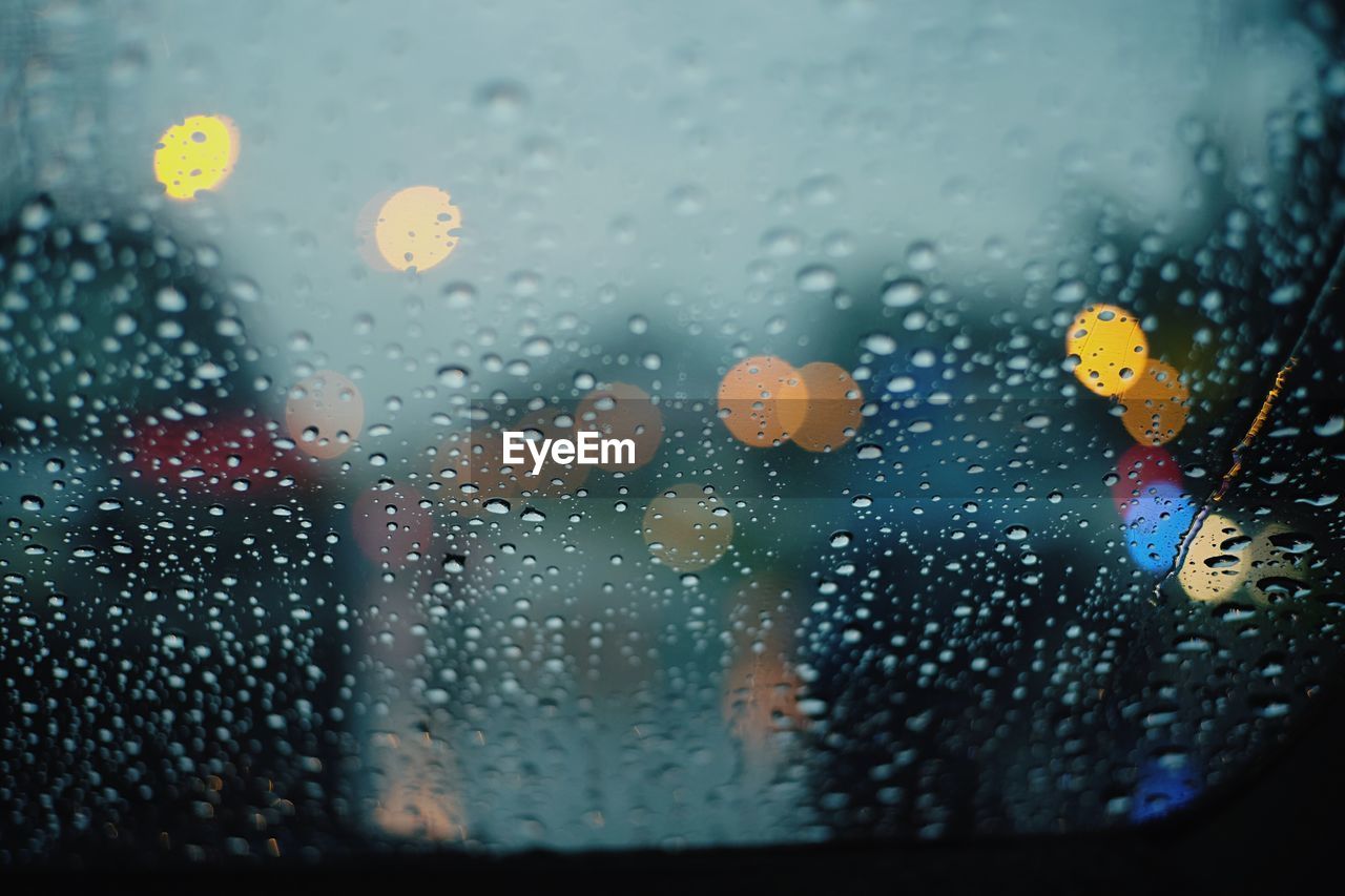 Full frame shot of wet car window in rainy season