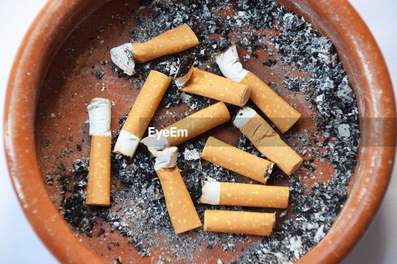 Directly above shot of cigarettes in ashtray