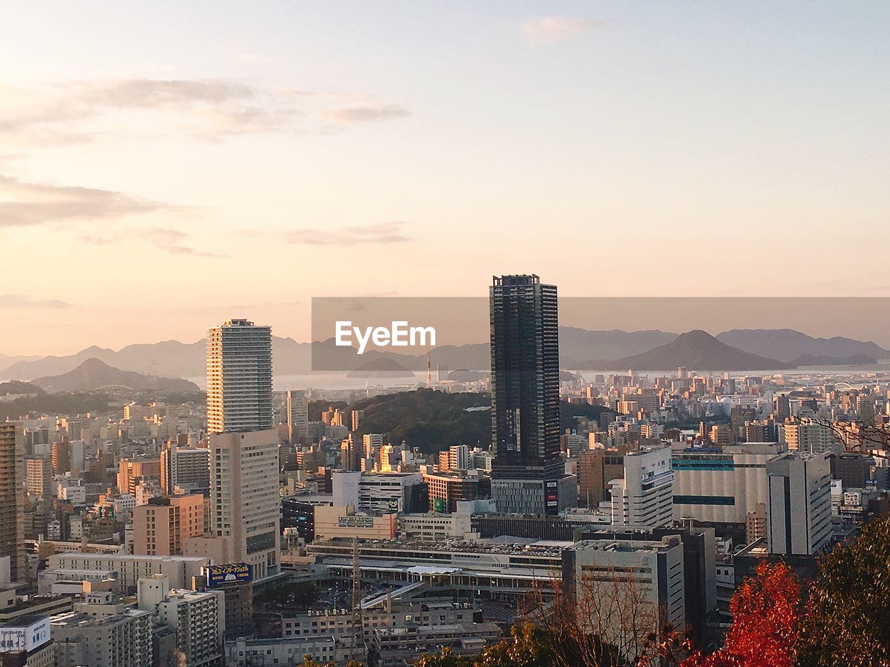 High angle view of buildings in city against sky during sunset