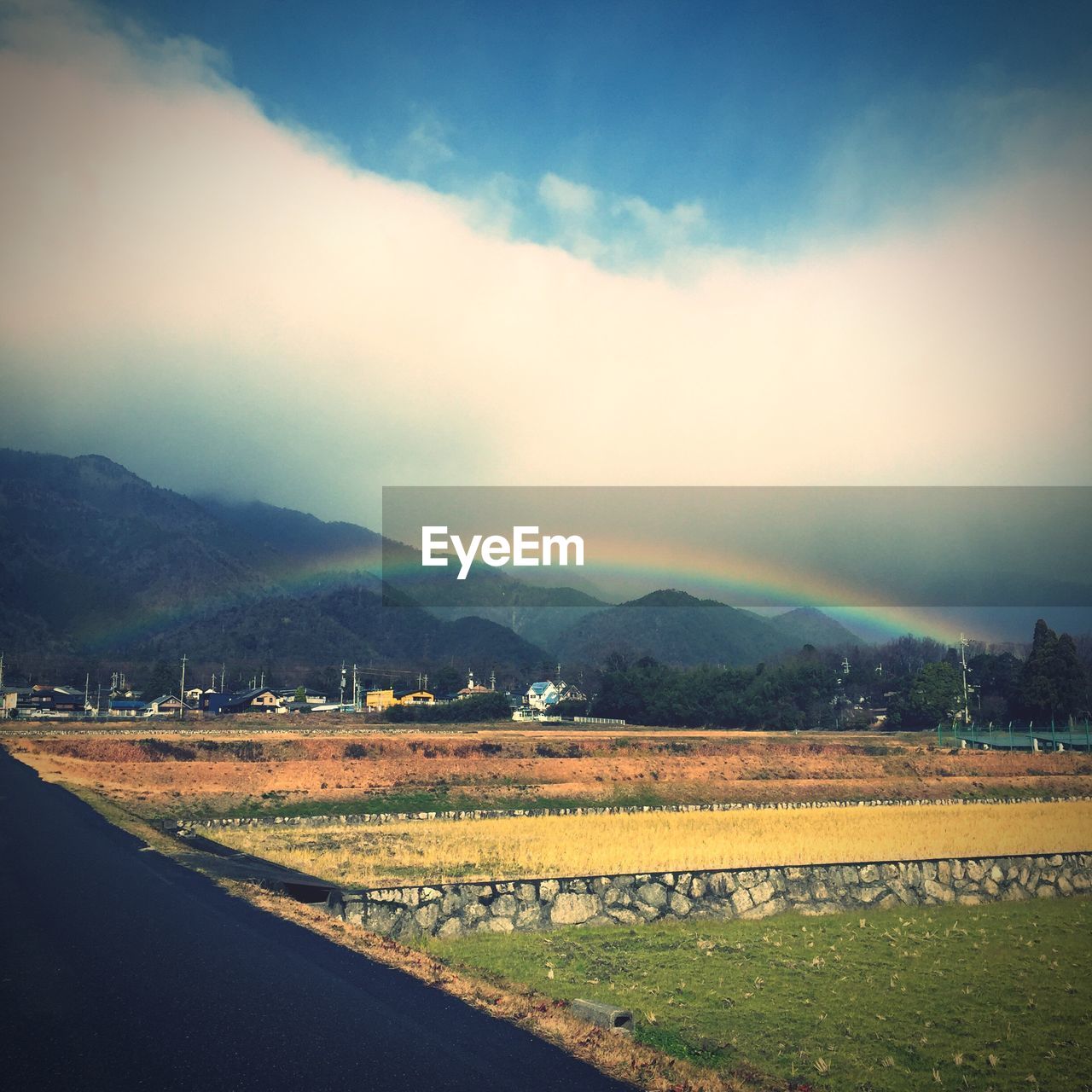 SCENIC VIEW OF MOUNTAINS AGAINST CLOUDY SKY