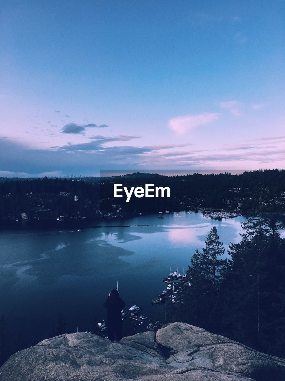 Scenic view of lake against sky during sunset