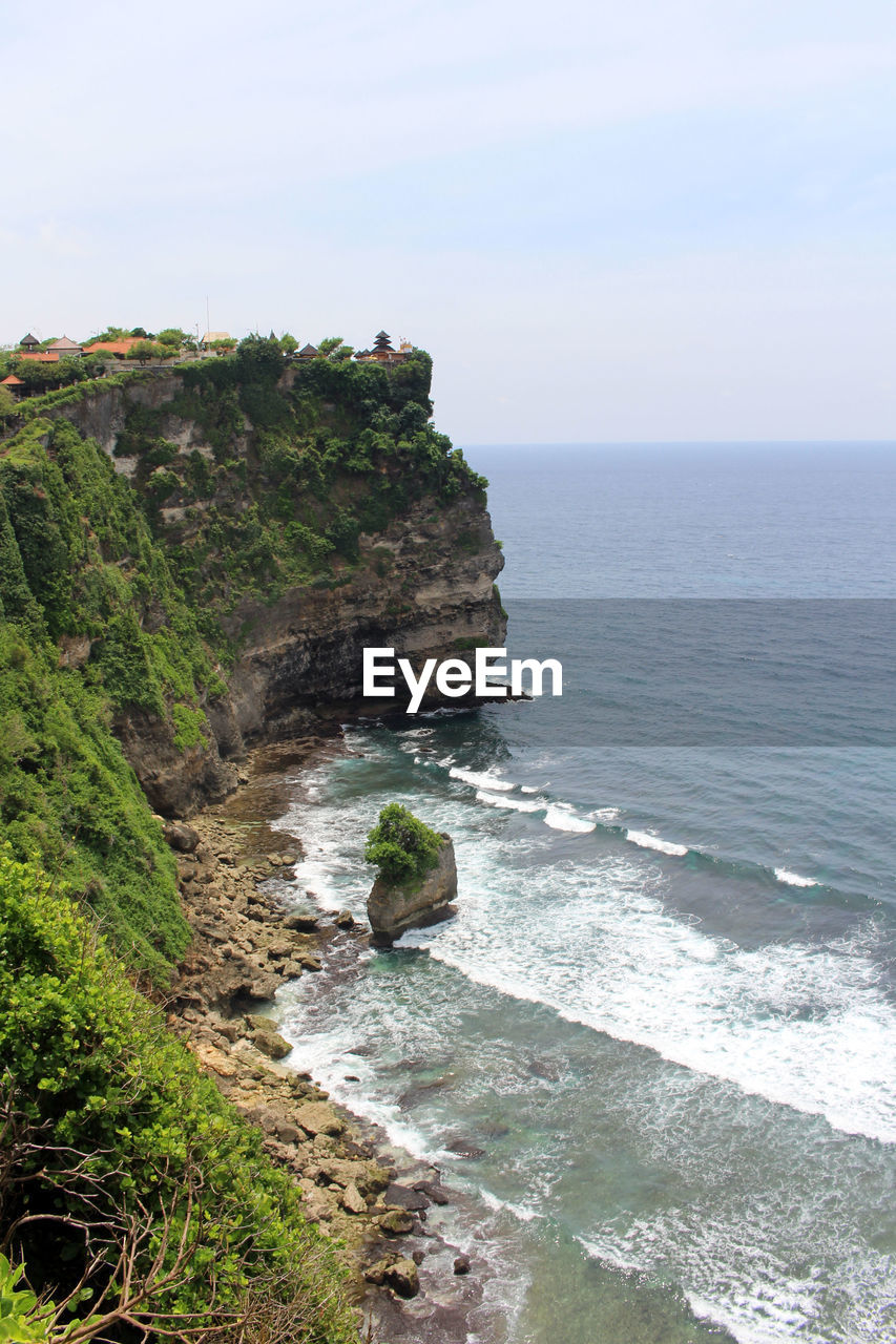 sea, water, land, scenics - nature, beauty in nature, beach, cliff, sky, nature, rock, coast, body of water, horizon, horizon over water, ocean, shore, tranquility, tranquil scene, no people, coastline, idyllic, rock formation, non-urban scene, day, plant, travel destinations, outdoors, terrain, wave, travel, environment, motion, bay, cove, vacation, sports, water sports, tourism, landscape