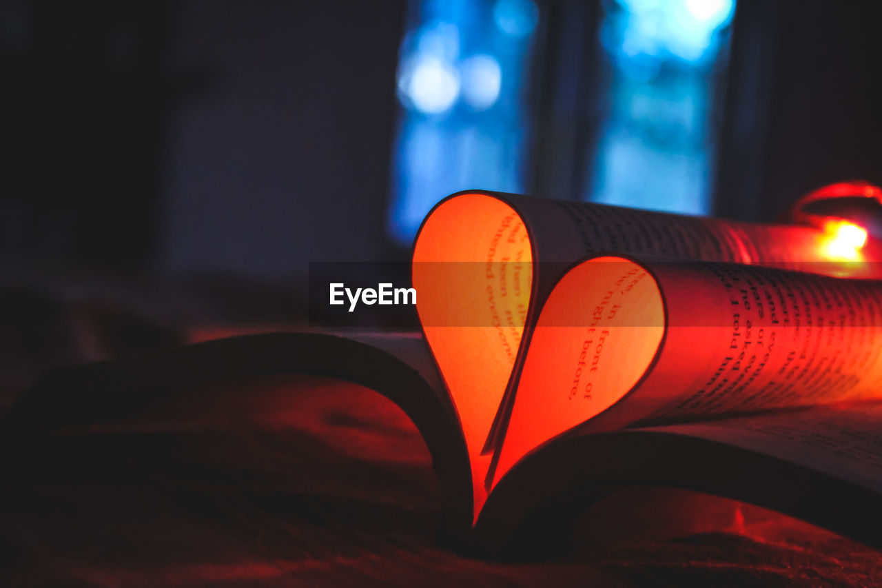 Close-up of heart shape on book