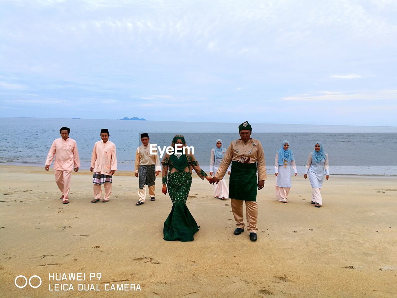 PEOPLE STANDING ON BEACH