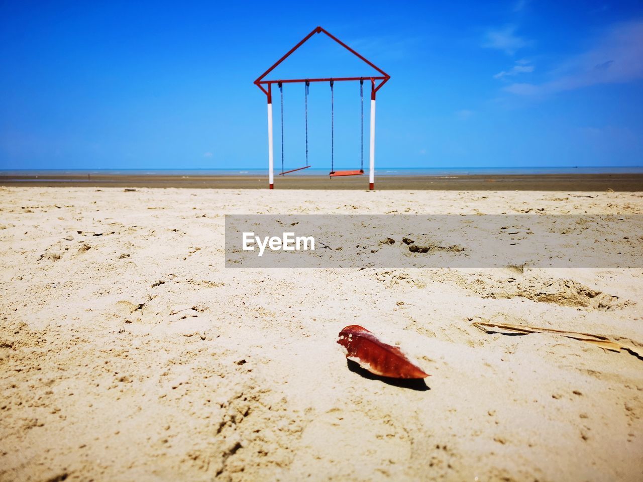 LIFEGUARD HUT ON BEACH AGAINST SKY