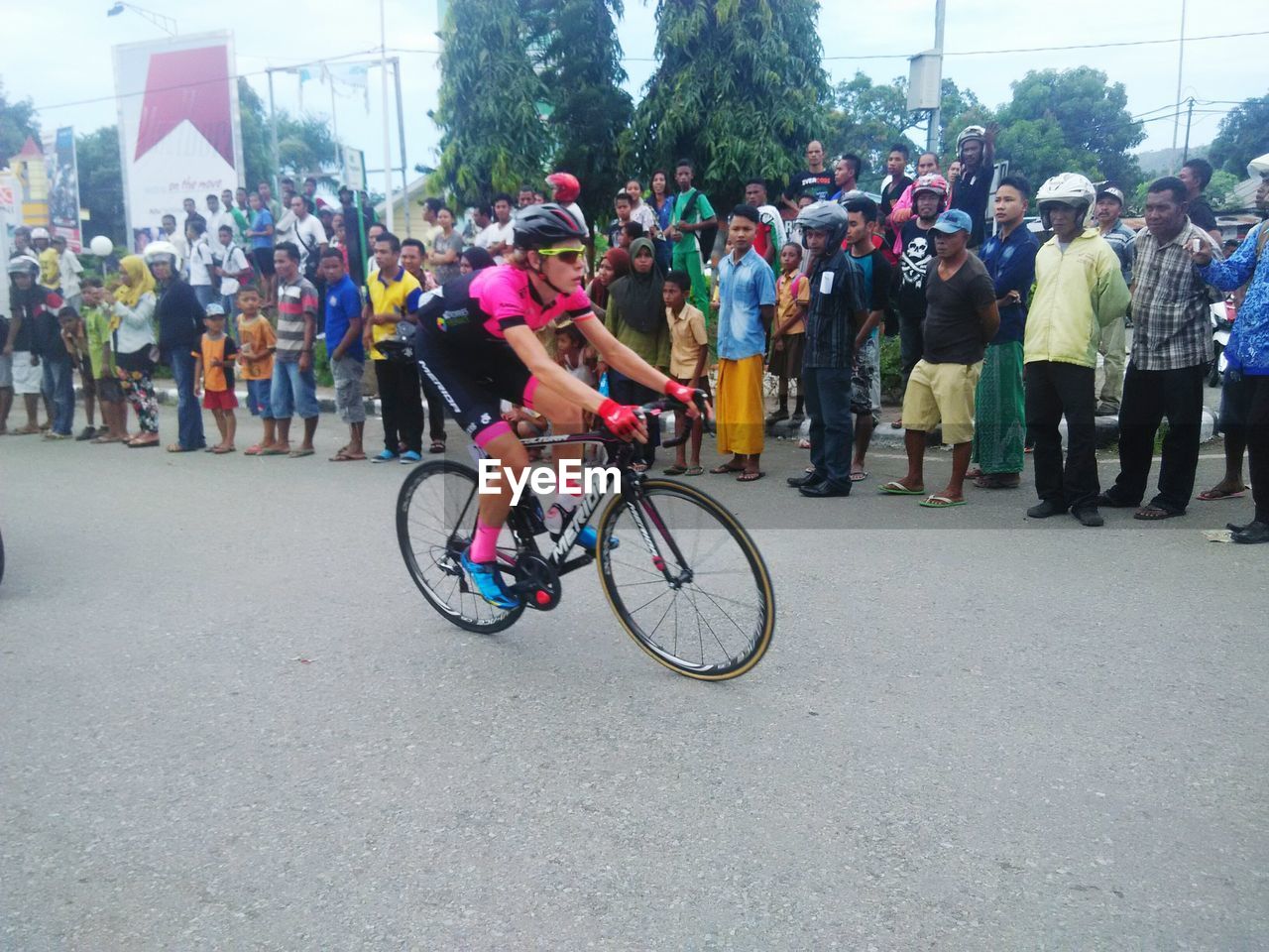 PERSON RIDING BICYCLE ON ROAD