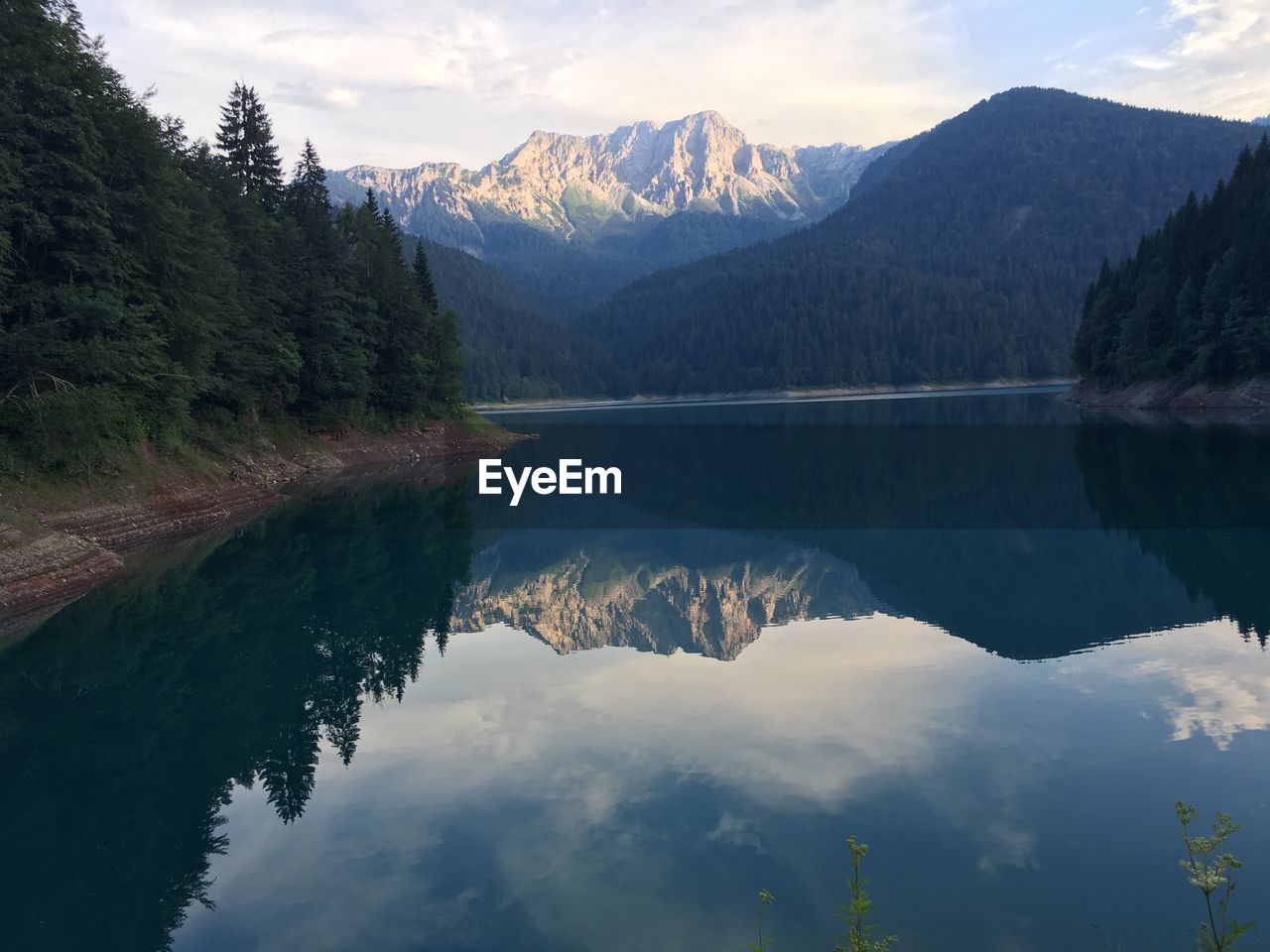 SCENIC VIEW OF MOUNTAINS AND LAKE