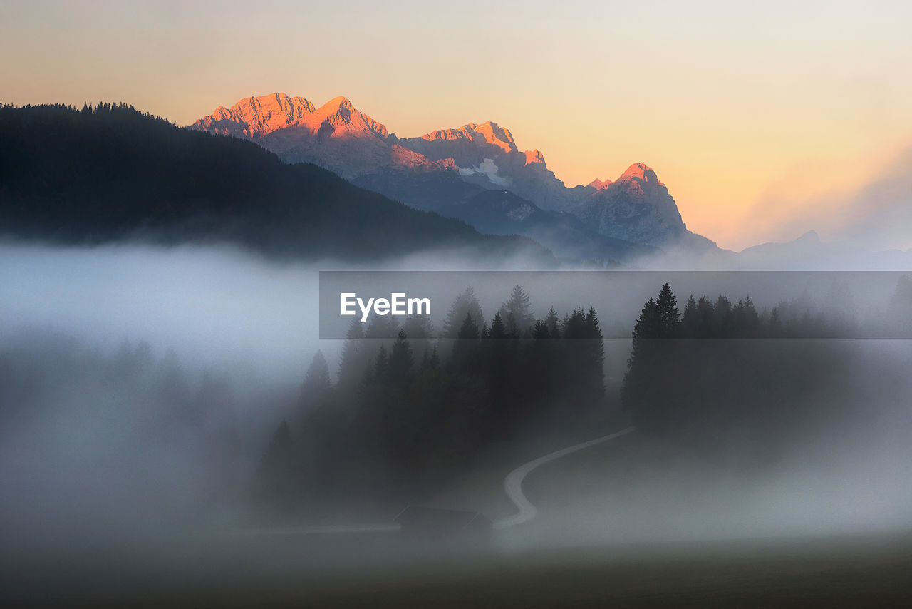 Scenic view of mountains against sky during sunset