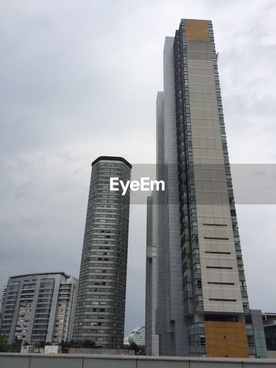 Low angle view of tall buildings against sky