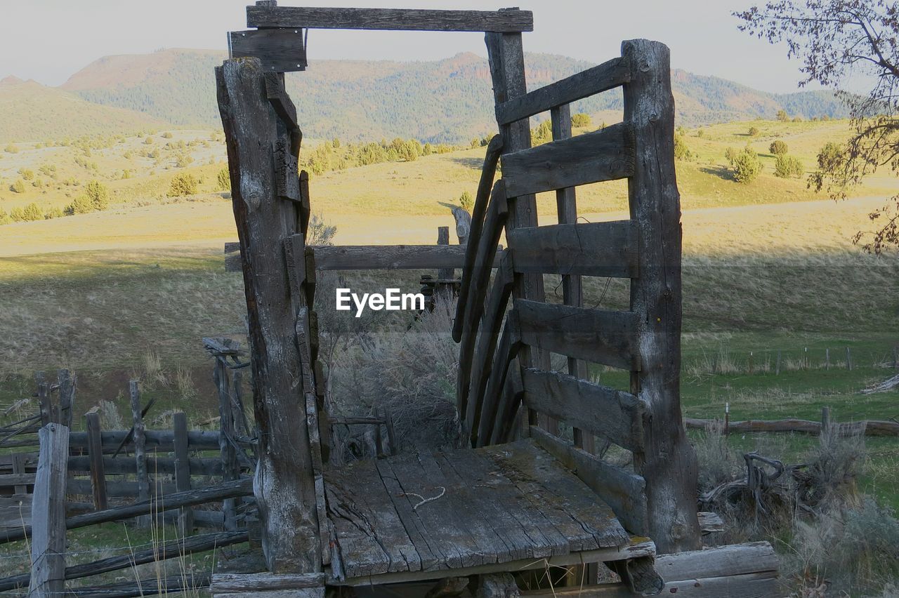 Close-up of old wooden structure on field