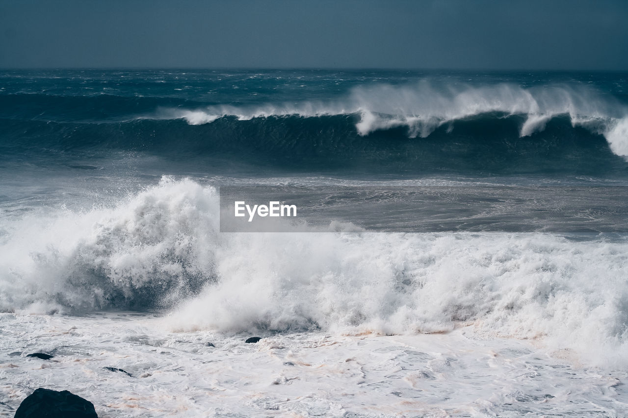 waves splashing on beach