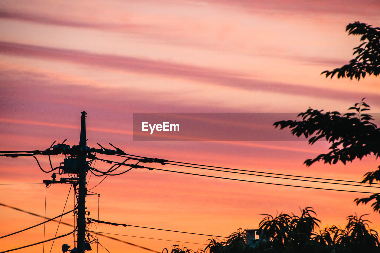 sunset, cable, technology, sky, electricity, silhouette, power line, electricity pylon, power supply, afterglow, nature, orange color, dusk, evening, power generation, cloud, no people, tree, dramatic sky, outdoors, plant, sunlight, beauty in nature, low angle view, romantic sky, red sky at morning, communication, scenics - nature