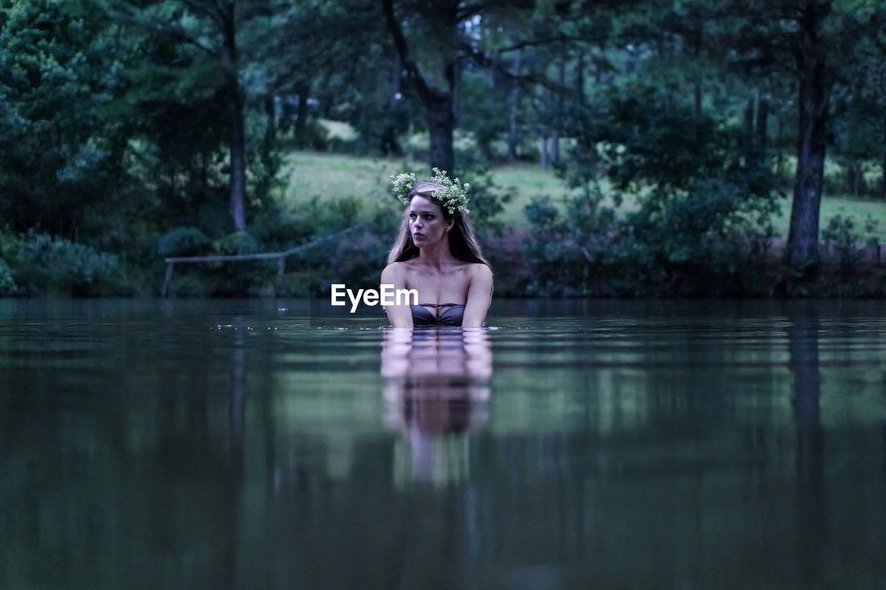 Portrait of a young woman in lake