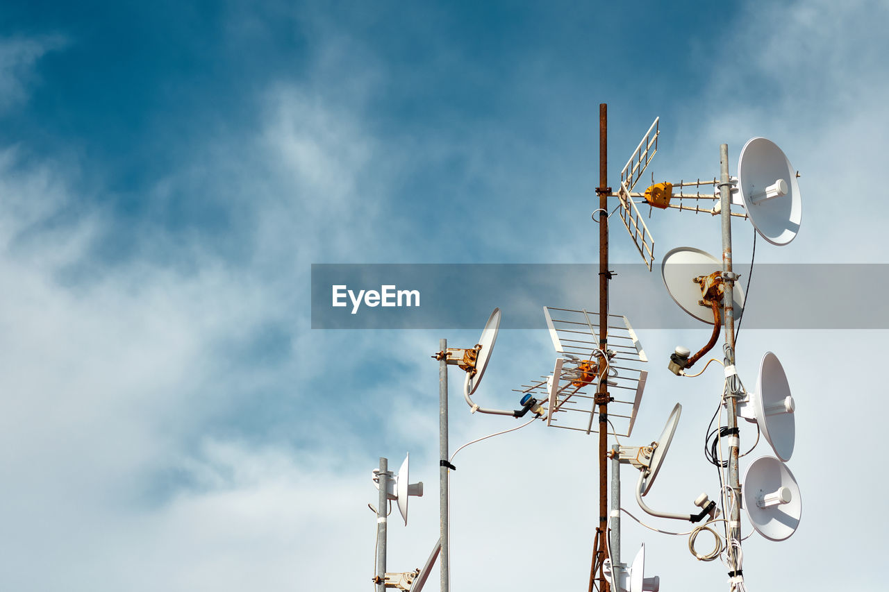 Low angle view of antenna against sky