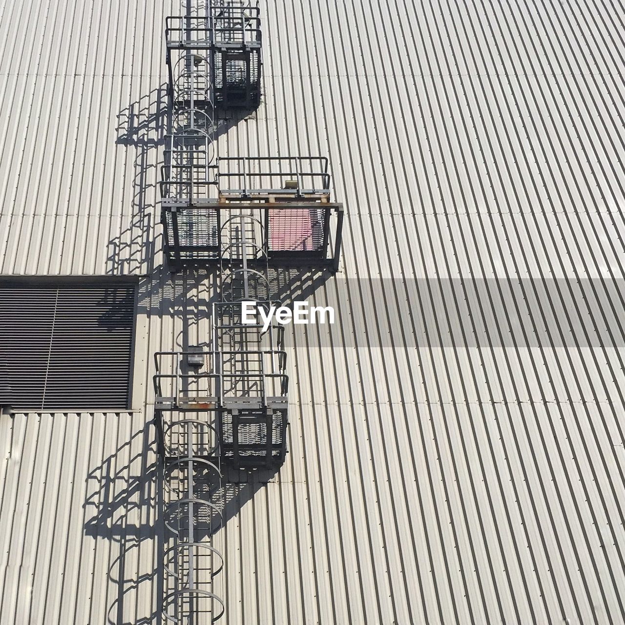 Low angle view of ladder on industrial building