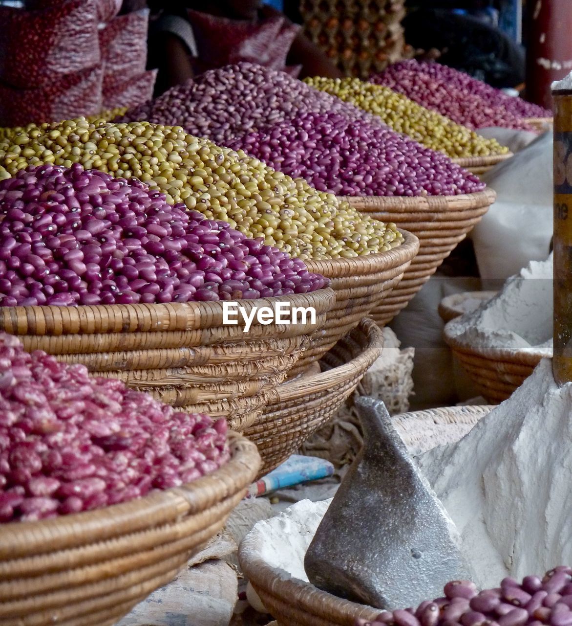 Beans in baskets for sale at street market