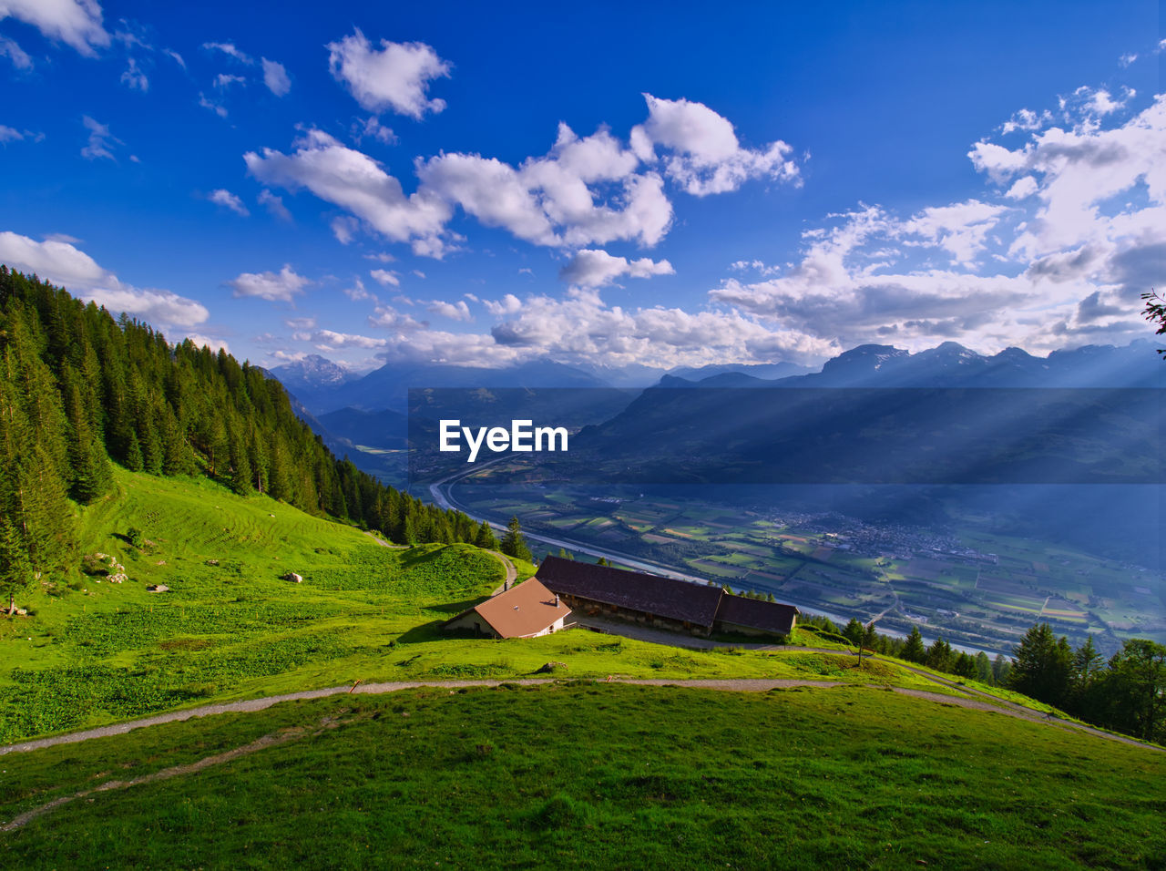 Scenic view of landscape and mountains against sky