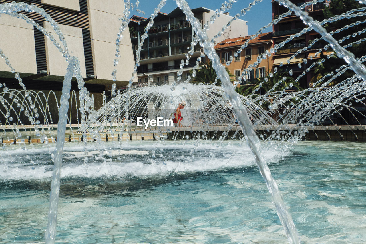 WATER SPLASHING IN SWIMMING POOL