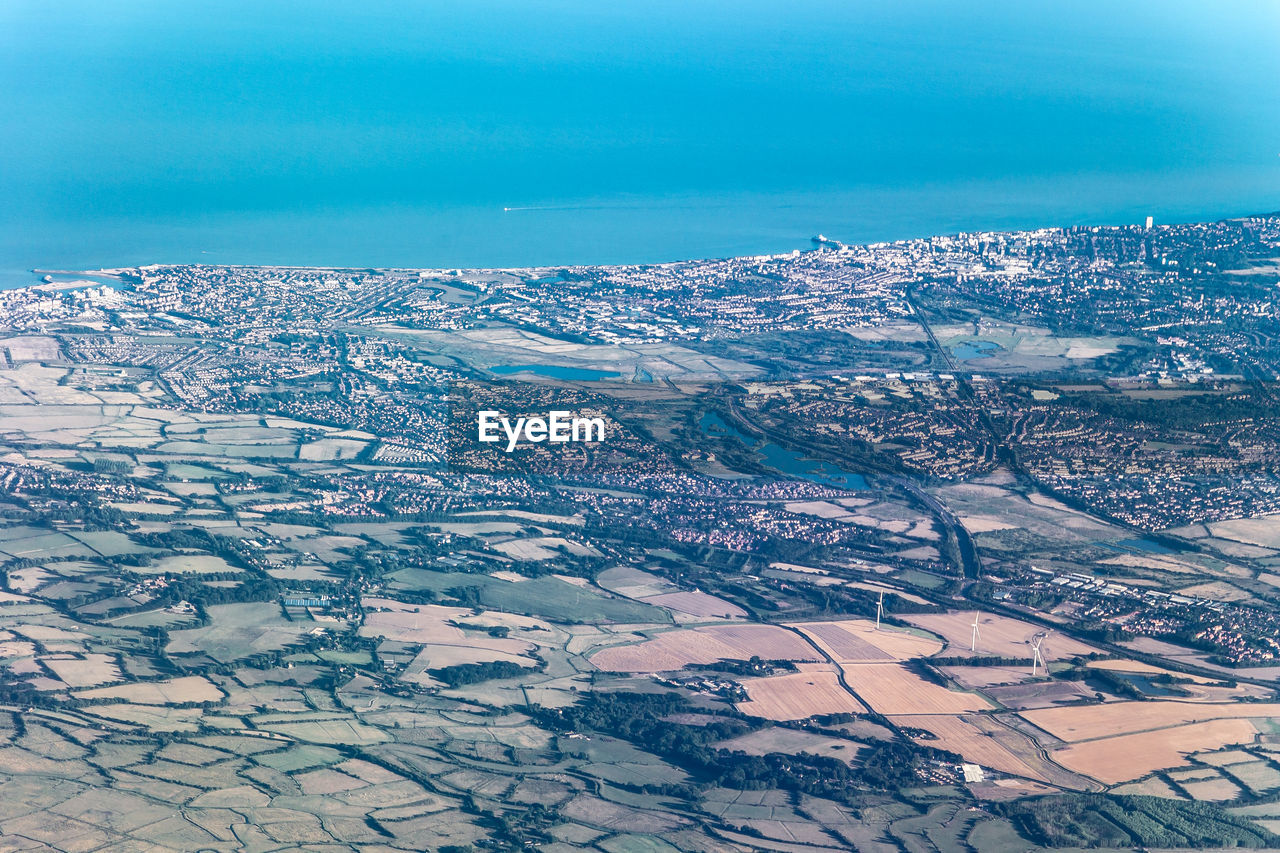 AERIAL VIEW OF SNOWCAPPED LANDSCAPE AGAINST SKY