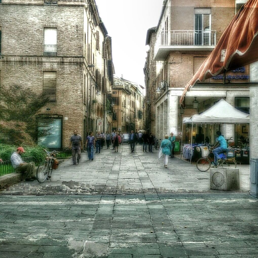 WOMAN STANDING IN CITY