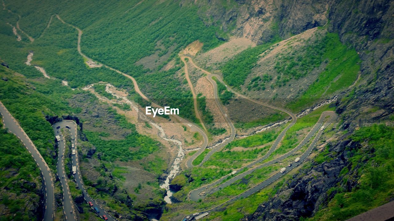 Aerial view of cars moving on road at mountains