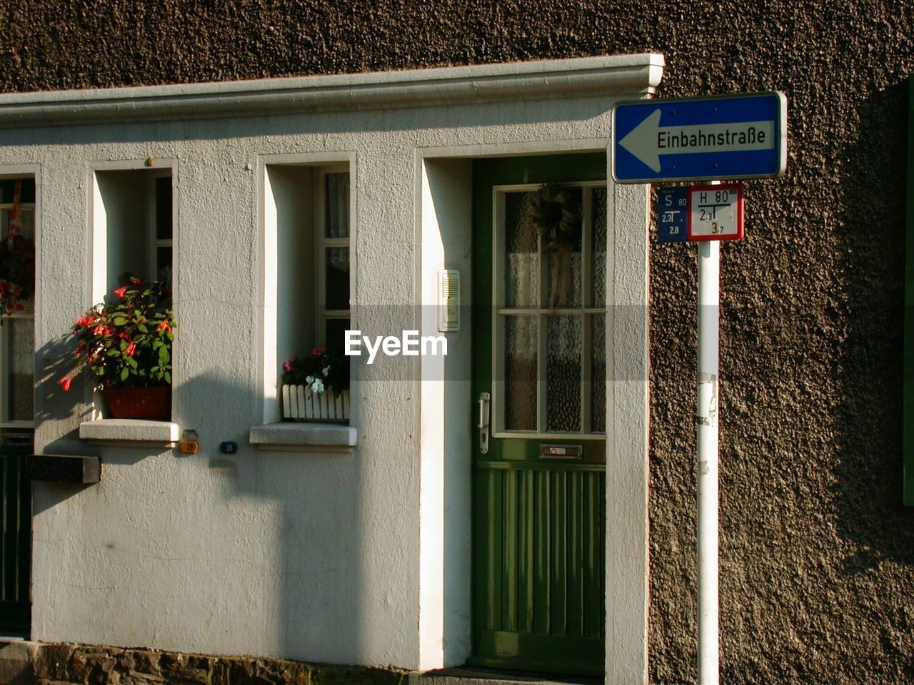 ROAD SIGN ON BUILDING