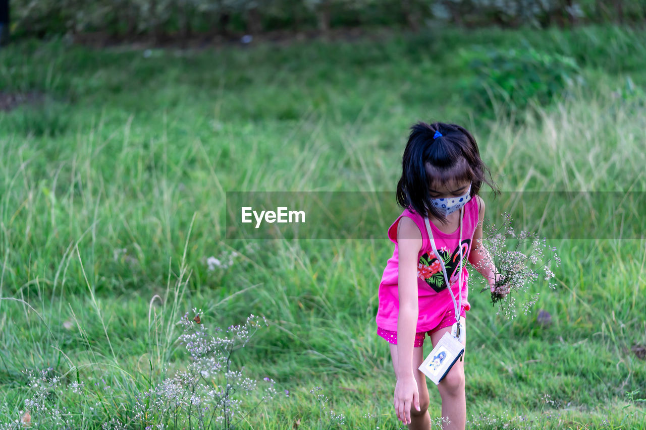 FULL LENGTH OF GIRL ON FIELD