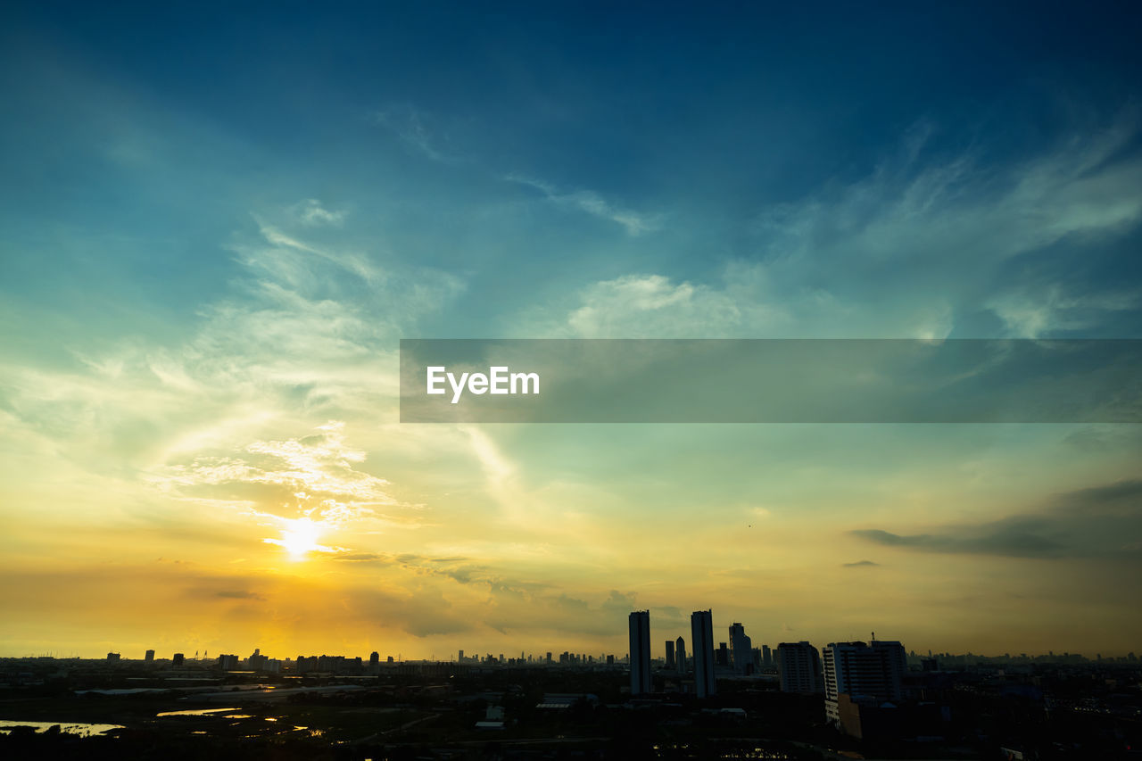 BUILDINGS AGAINST SKY DURING SUNSET