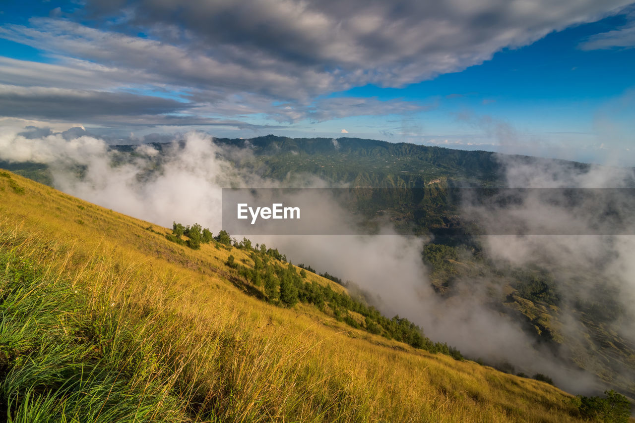 Scenic view of clouds over mountain